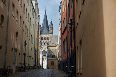 Alley amidst buildings in city