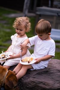 Boys sitting on ice cream