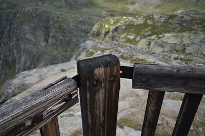 High angle view of wooden post on fence