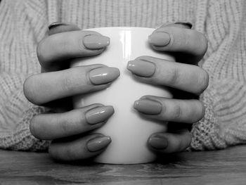 Close-up of human hand on table