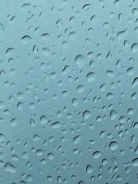 Full frame shot of wet window in rainy season