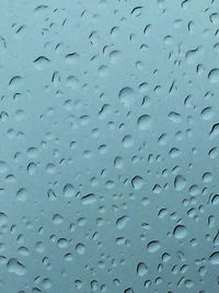 Full frame shot of wet window in rainy season
