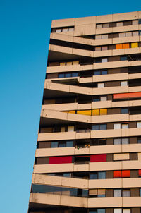 Low angle view of building against clear blue sky