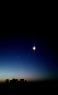 Scenic view of moon against blue sky at night