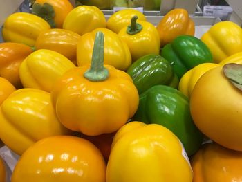 Full frame shot of yellow bell peppers for sale in market