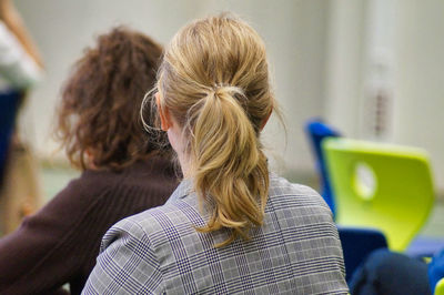 Rear view of woman using mobile phone