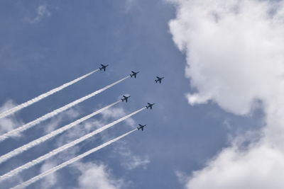 Low angle view of airplane flying in sky