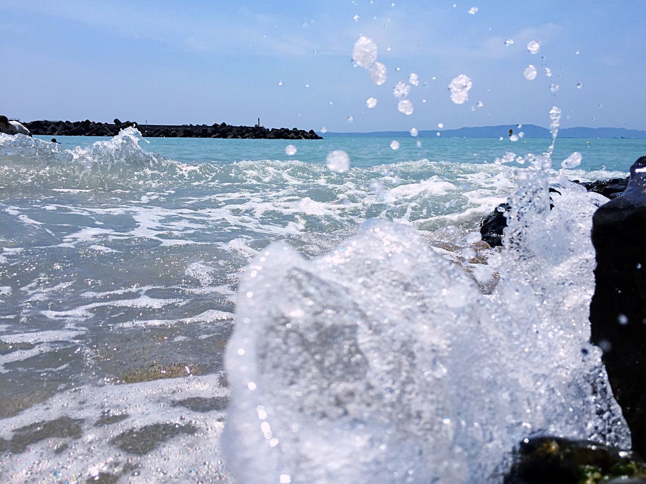 sea, water, leisure activity, horizon over water, lifestyles, wave, surf, enjoyment, men, beach, sky, scenics, splashing, motion, vacations, beauty in nature, nature, shore