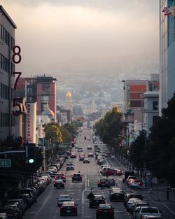 Traffic on city street against sky