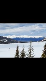 Scenic view of frozen lake against sky