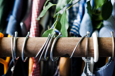 Close-up of clothes hanging on display in store