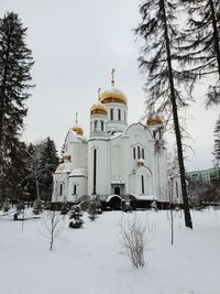 Traditional building against sky during winter