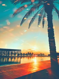 Scenic view of swimming pool against sky during sunset