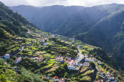 High angle view of village on mountain slope