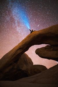 Scenic view of desert against sky at night