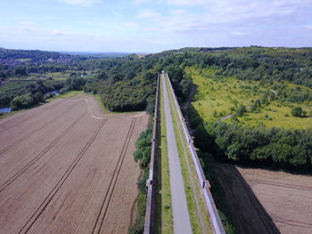 Empty road along countryside landscape