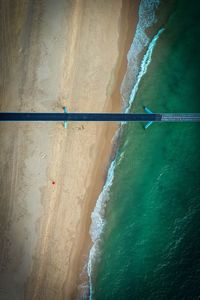 High angle view of sea waves splashing on shore