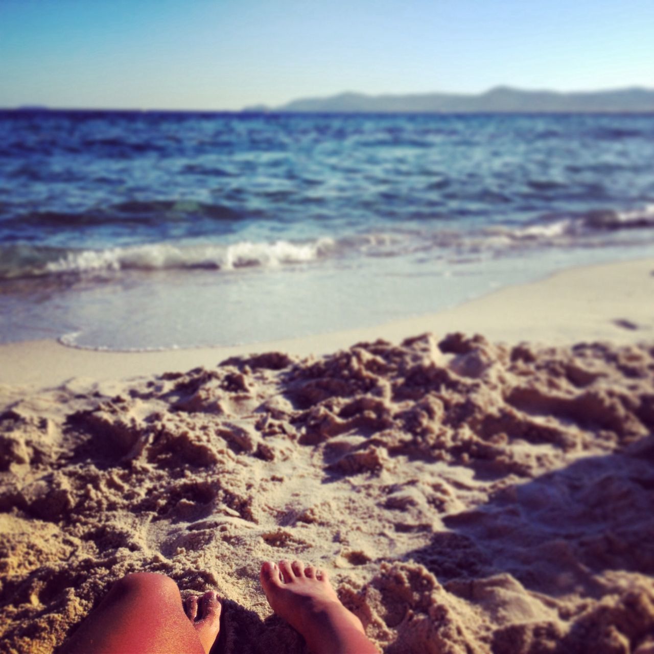 sea, beach, personal perspective, water, sand, person, shore, low section, horizon over water, vacations, barefoot, leisure activity, scenics, part of, tranquility, tranquil scene, beauty in nature