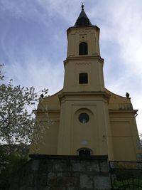Low angle view of clock tower against sky