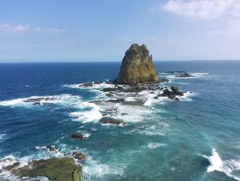Shot of the landscape of rocky beach with giant rock in jember, east java, indonesia