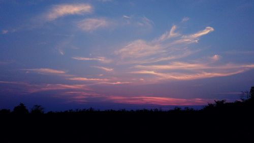 Scenic view of dramatic sky at sunset