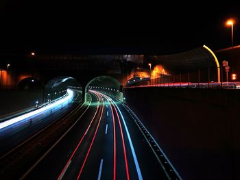 High angle view of light trails on road at night