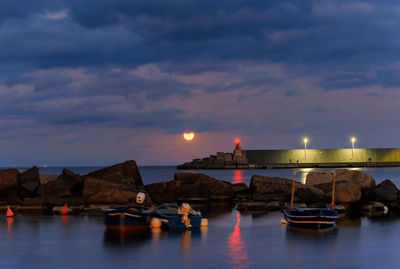 Scenic view of sea against sky at night