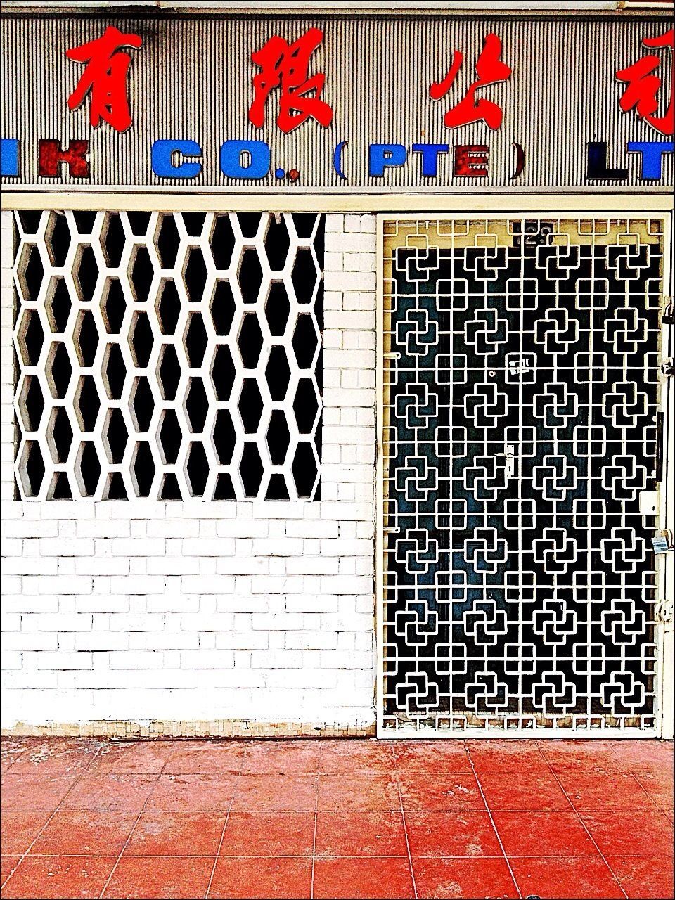 architecture, building exterior, built structure, red, wall - building feature, window, wall, closed, brick wall, text, pattern, western script, protection, door, day, safety, communication, outdoors, no people, identity