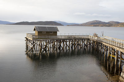 House on wooden port in a norwegian fjord