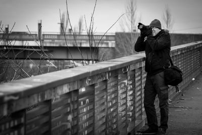 Full length of man with city in background