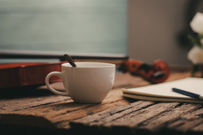 Close-up of coffee cup on table