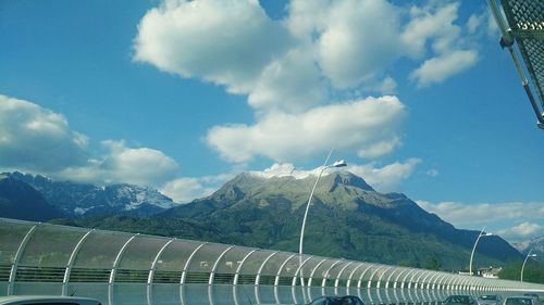 Mountain range against cloudy sky