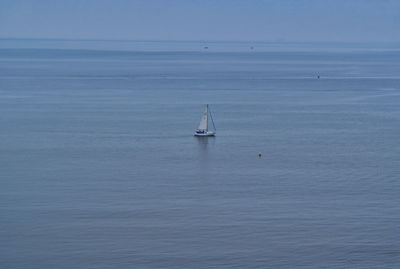 High angle view of sailboat sailing on sea against sky