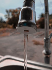 Close-up of water pouring from faucet