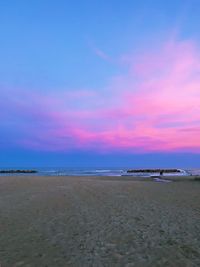 View of beach at sunset