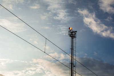 Low angle view of communication tower against sky