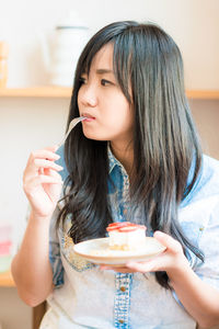 Beautiful woman holding chocolate cake