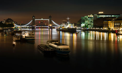 Sailboats in city at night