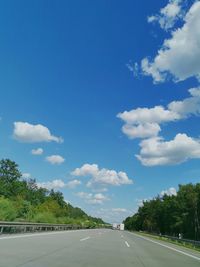 Empty road against sky