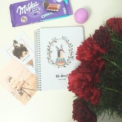 Close-up of flower on book