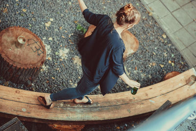 High angle view of boy playing with umbrella