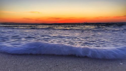 Scenic view of sea at sunset