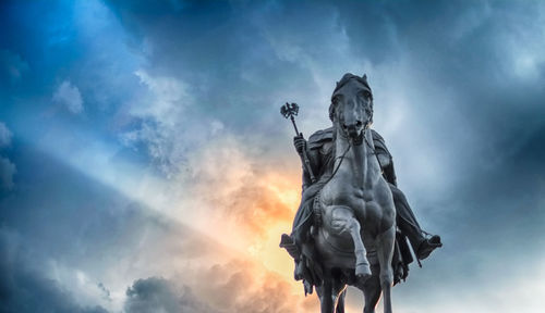 Low angle view of statue against sky