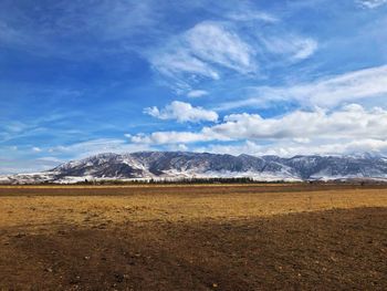 Scenic view of snowcapped mountains against sky