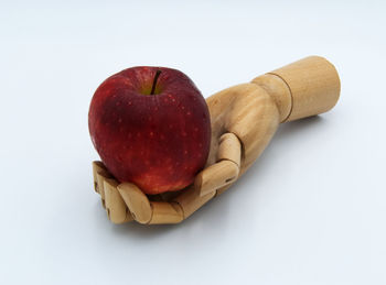 High angle view of apples on table against white background