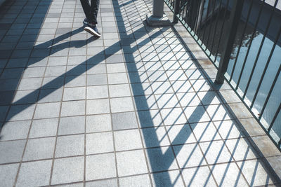 Low section of people walking on footpath