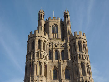 Low angle view of historical building against blue sky