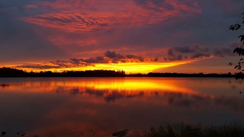 Scenic view of lake at sunset