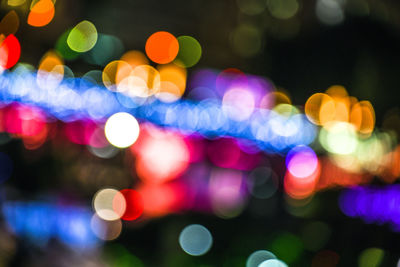 Defocused image of illuminated lights at night