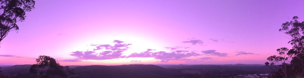 Scenic view of silhouette mountains against sky during sunset